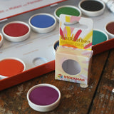 Stockmar Opaque Watercolour Replacements in red violet purple with the 12 hole watercolour tin set in the back.