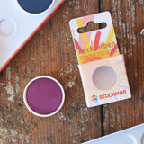 Stockmar Opaque Watercolour Replacements in red violet purple with the 12 hole watercolour tin set in the back.