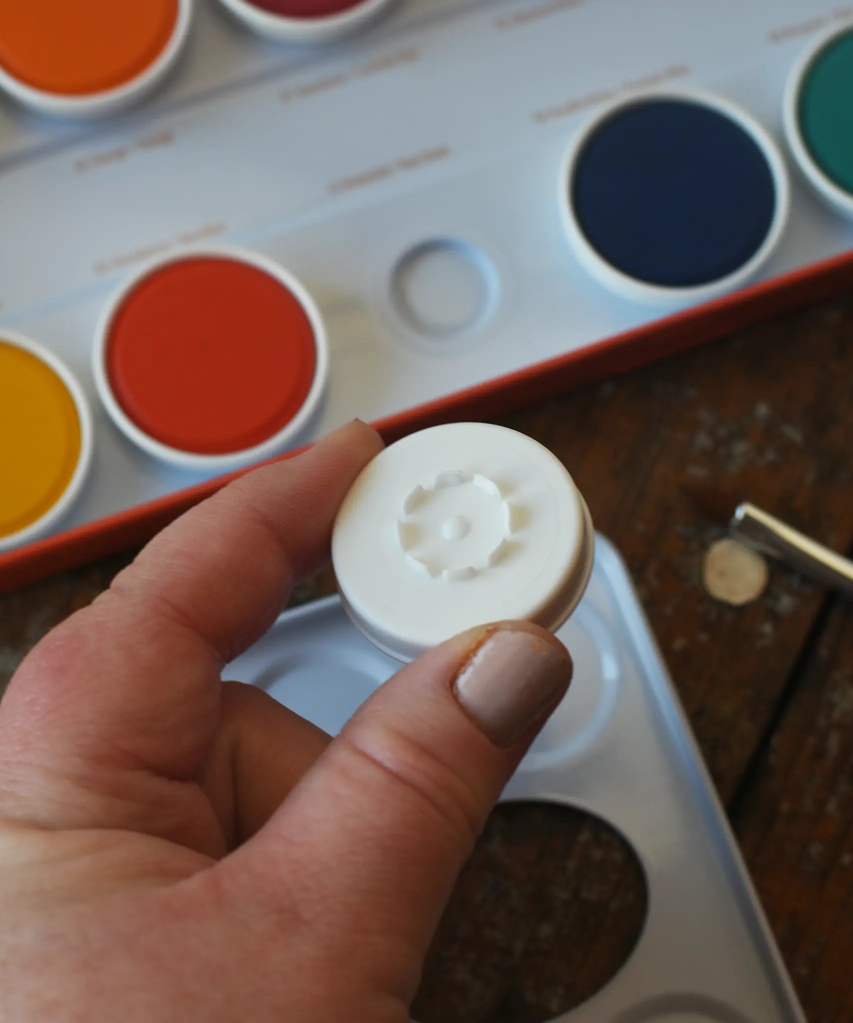 Bottom of the removable paint pans in the Stockmar Opaque Watercolour Paint Tin Set.