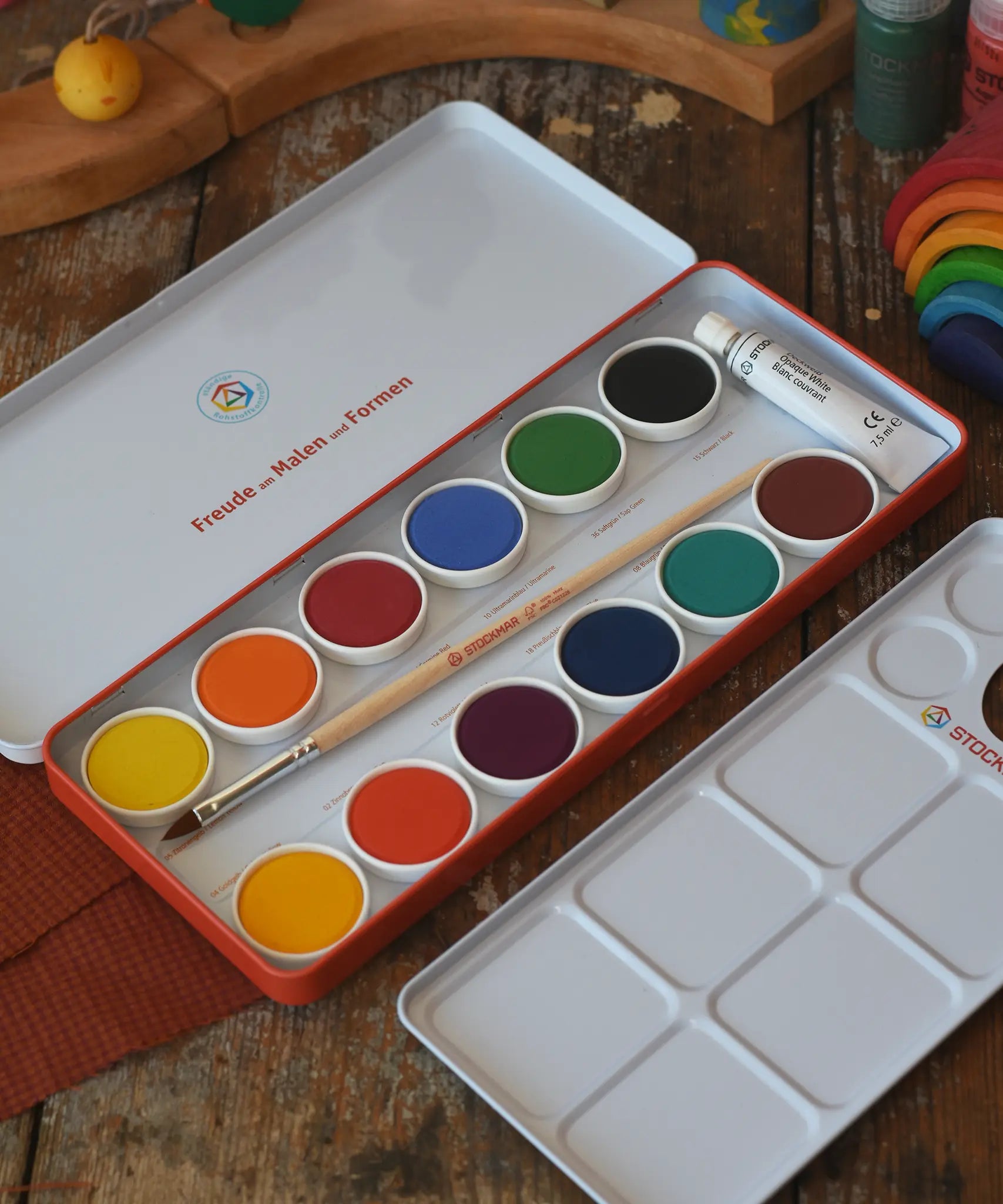 Stockmar Opaque Watercolour Paint Tin Set with 12 colours, palette, paintbrush, opaque white paint tube all in a metal storage tin.