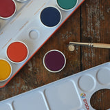 Close up of removable paint pans in the Stockmar Opaque Watercolour Paint Tin Set.