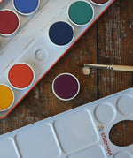Close up of removable paint pans in the Stockmar Opaque Watercolour Paint Tin Set.