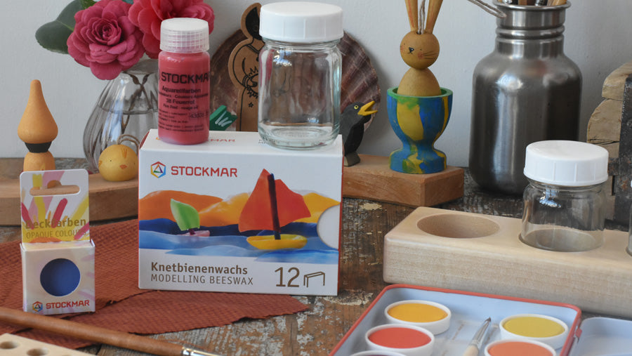 Stokmar modelling beeswax, watercolour paints, and paint jars displayed in a Waldorf education setting in the Babipur art room. 