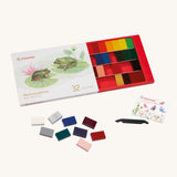 Stockmar set of 32 coloured Wax Blocks in a cardboard packaging box . The set comes with a black coloured wax scraper tool. 