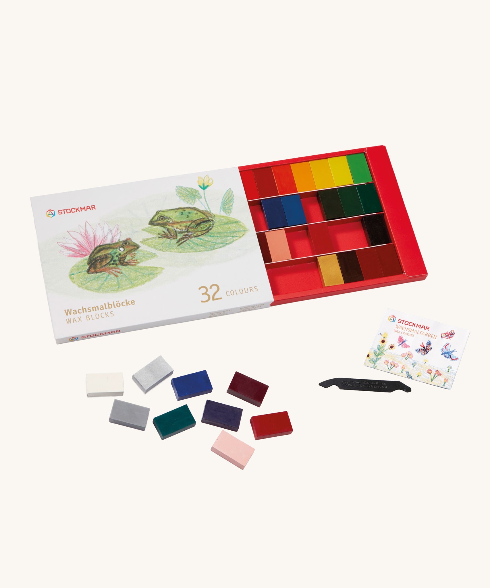 Stockmar set of 32 coloured Wax Blocks in a cardboard packaging box . The set comes with a black coloured wax scraper tool. 