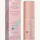 Pink with green leaves stretch mark oil box and a pink bottle on a cream background.