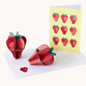 Studio Roof 3D Pop Out Card Strawberries. 3D DIY cardboard strawberries next to a matching greetings card 