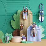 Studio roof eco-friendly cardboard slotting insect models attached to some brown