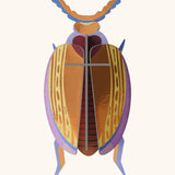 A Studio Roof 3D Cuprum beetle cardboard wall art fully assembled with a metallic finish on the pieces.