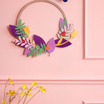 Studio roof blossom wreath pop out card decoration hanging from a pink wall