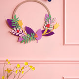 Studio roof blossom wreath pop out card decoration hanging from a pink wall