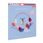Packaging for the Studio roof cardboard pop out botanical wreath wall decoration on a white background