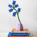 Studio Roof campanula everlasting flower decoration craft kit shown built and displayed in small purple vase.