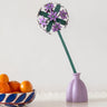 Studio Roof allium everlasting flower decoration craft kit shown built and placed in a purple vase.