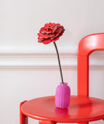 Studio Roof rose everlasting flower cardboard craft kit shown built and displayed in a small pink vase.