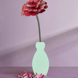 Studio Roof rose everlasting flower cardboard craft kit shown built and displayed in a small vase.