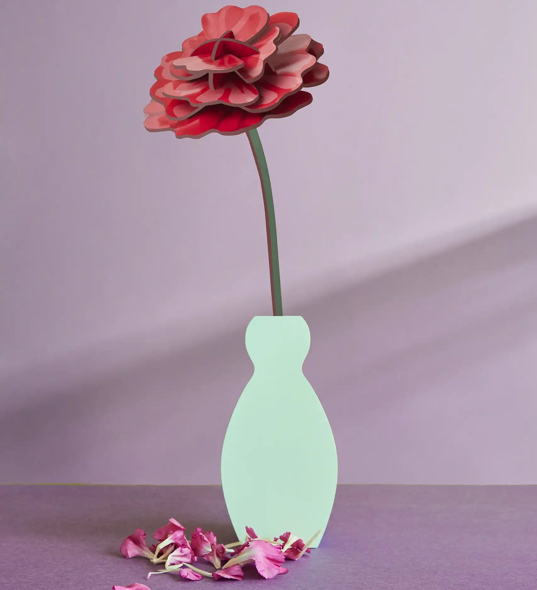 Studio Roof rose everlasting flower cardboard craft kit shown built and displayed in a small vase.