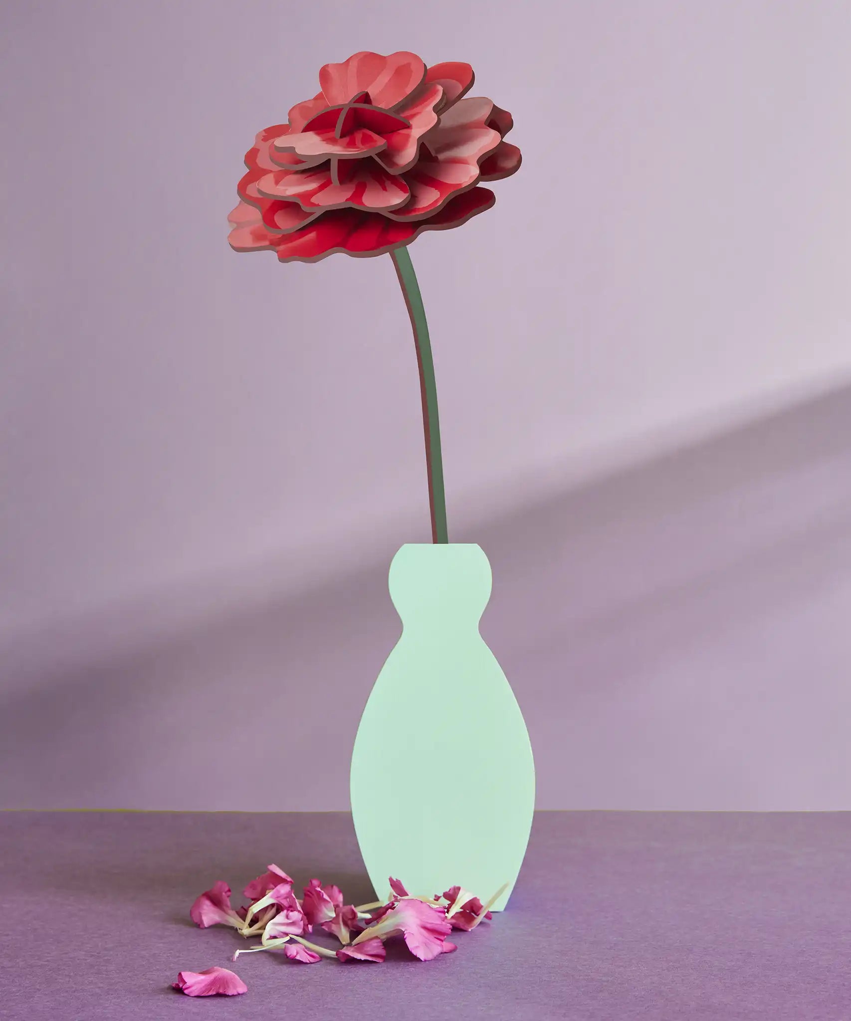 Studio Roof rose everlasting flower cardboard craft kit shown built and displayed in a small vase.