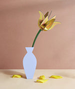 Studio Roof yellow tulip everlasting flower cardboard craft kit shown built and displayed in a vase.