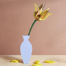Studio Roof yellow tulip everlasting flower cardboard craft kit shown built and displayed in a vase.