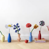 Studio Roof everlasting flower decoration craft kits shown built and displayed in small vases.