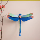 Studio Roof Blue Dragonfly Cardboard Wall Art shown built and displayed on a wall.