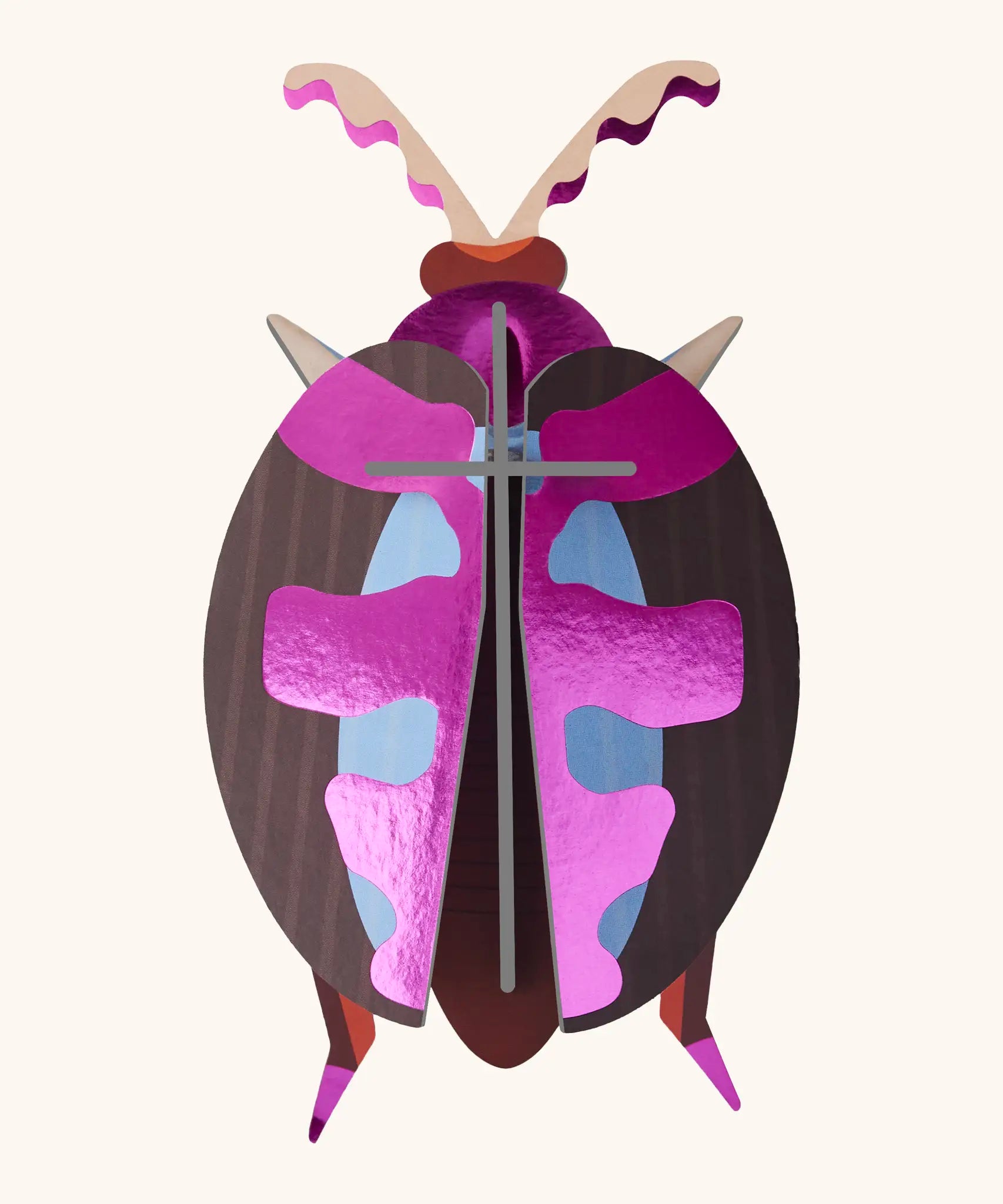 A Studio Roof 3D lumen pink beetle cardboard wall art fully assembled with a metallic finish on the pieces.