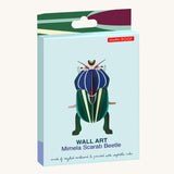 Studio Roof Mimela Scarab Beetle decoration in it's box pictured on a plain background