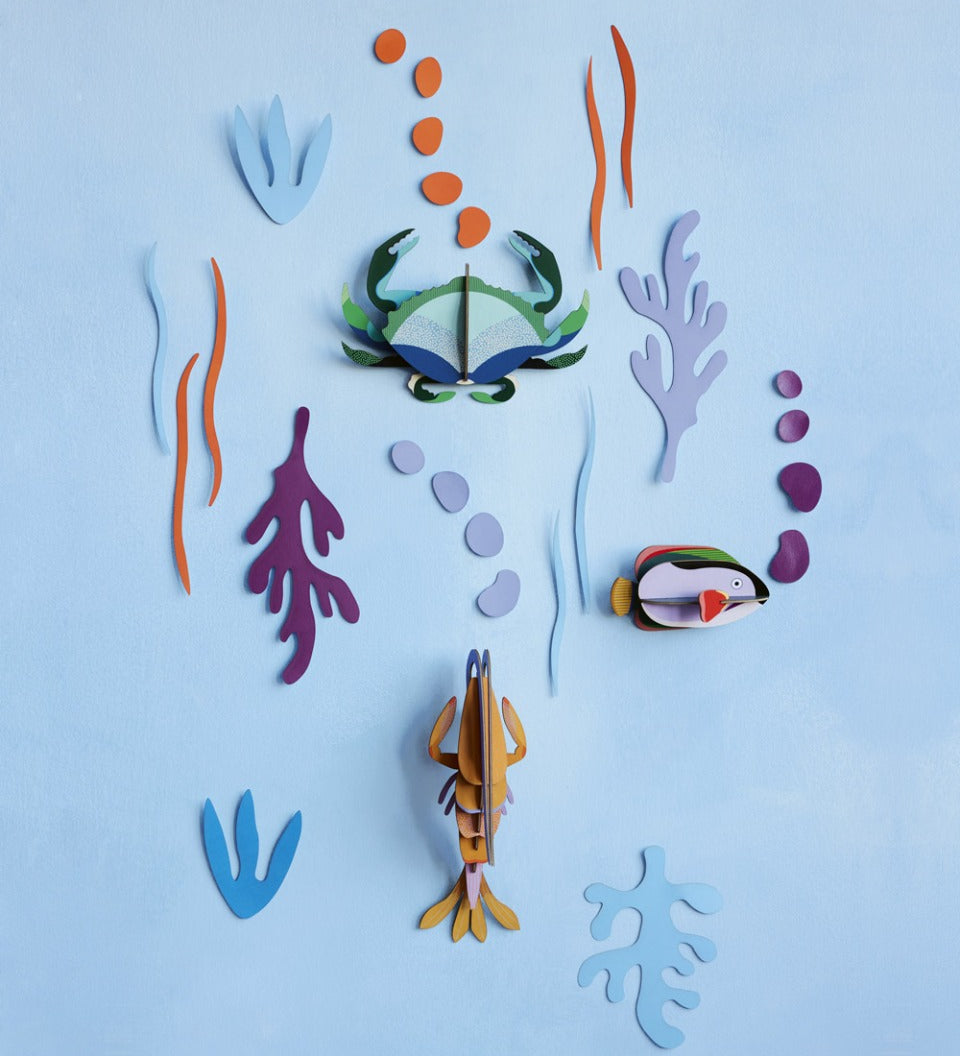 Studio Roof DIY card sea creature wall decorations on a blue wall