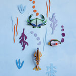 Studio Roof DIY card sea creature wall decorations on a blue wall