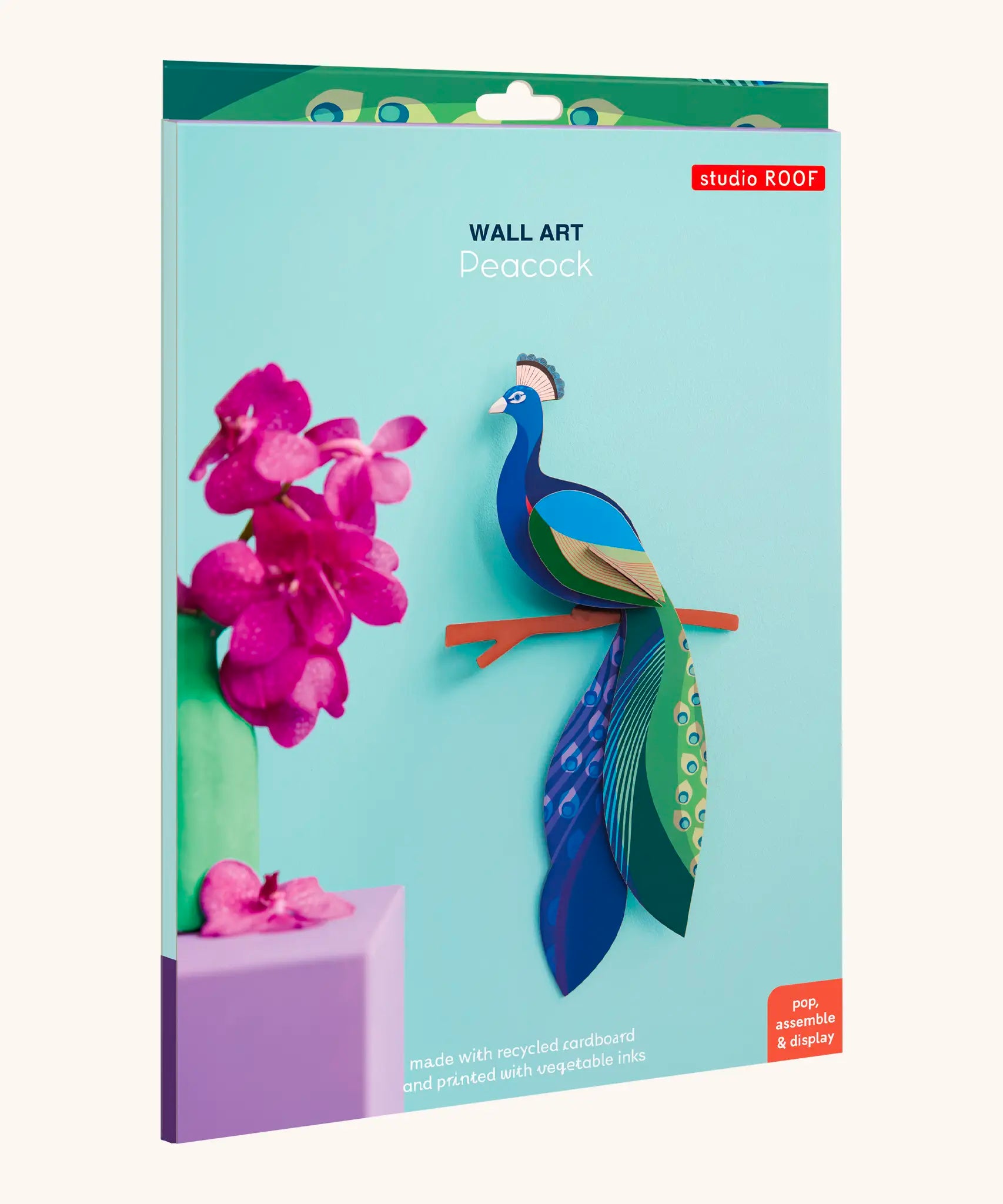 A Studio Roof 3D paradise peacock bird perched on a branch craft kit shown in it's packaging 