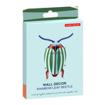 Packaging for the studio rood slotting cardboard rainbow leaf wall decoration on a white background