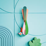 Studio roof slotting cardboard paradise bird oahu attached to a blue patterned wall