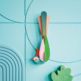 Studio roof slotting cardboard paradise bird oahu attached to a blue patterned wall