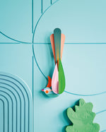 Studio roof slotting cardboard paradise bird oahu attached to a blue patterned wall