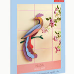 Studio Roof Nusa Bird of Paradise sitting on a green tree branch