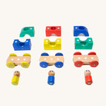 The pieces from the Tegu Big Top Magnetic Tram toy pictured on a plain background.