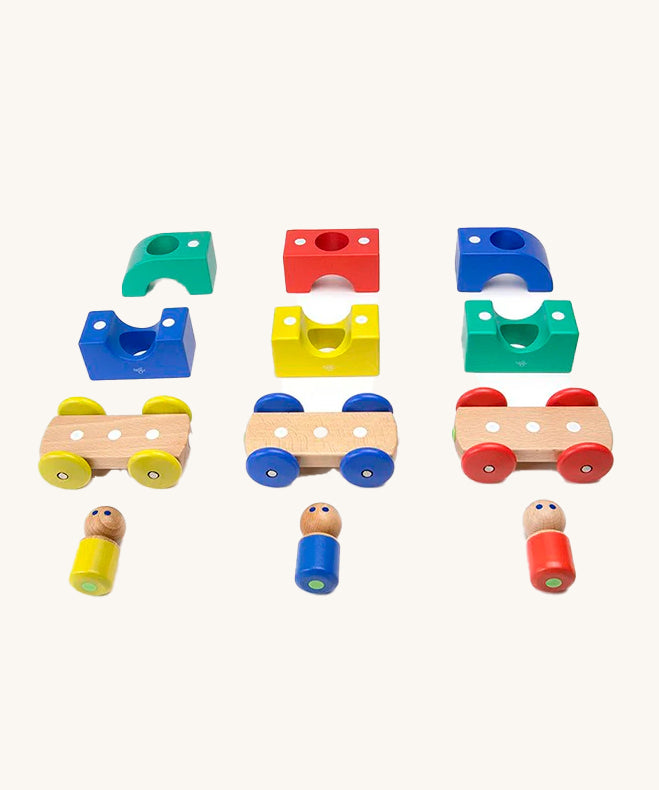 The pieces from the Tegu Big Top Magnetic Tram toy pictured on a plain background.