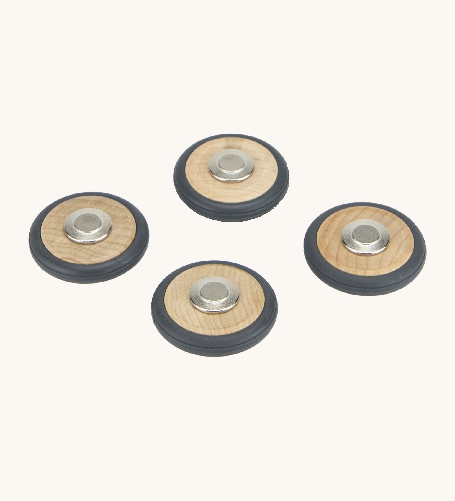 A set of 4 Tegu wooden magnetic wheels, perfect for creating push and pull vehicles