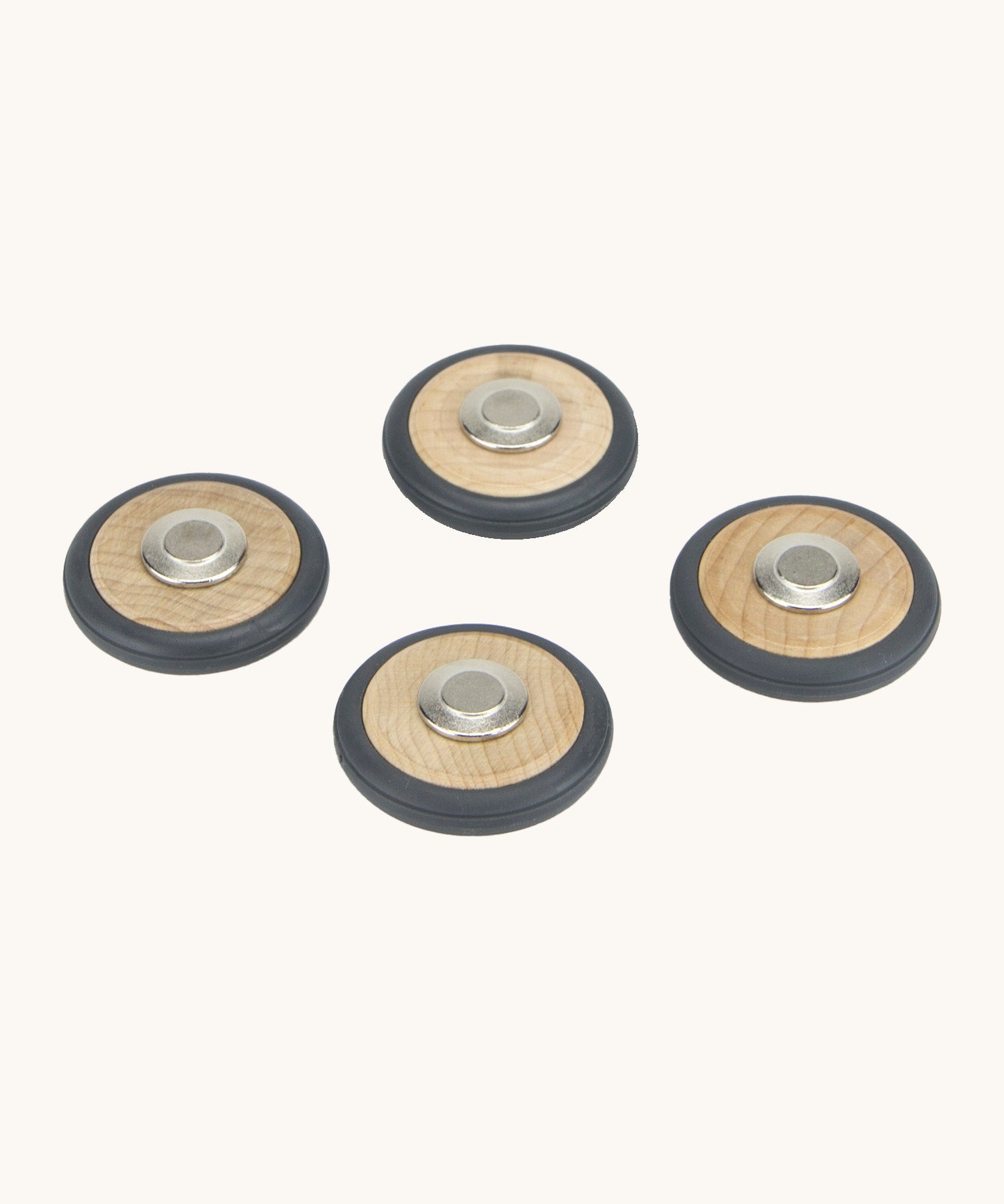 A set of 4 Tegu wooden magnetic wheels, perfect for creating push and pull vehicles