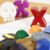 Close up of the crayon bug pirate treasure crayons laid out on a white book page
