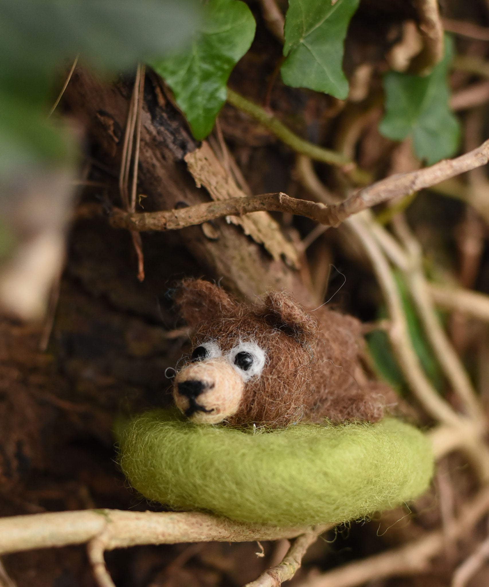 A fekted bear handmade using the The Makerss Amiguwoolli Snoozing Bear Mini Needle Felt crafting Kit.