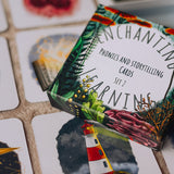 The Phive Enchanting Learning Phonics & Storytelling Cards - Set 2 in their box with some of the cards laid out underneath