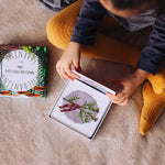 Child looking at a card from The Phive Enchanting Learning Phonics & Storytelling Cards - Set 2