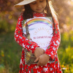 A child holding the The Phive Enchanting Learning Storywriter's Book - The Kingdom