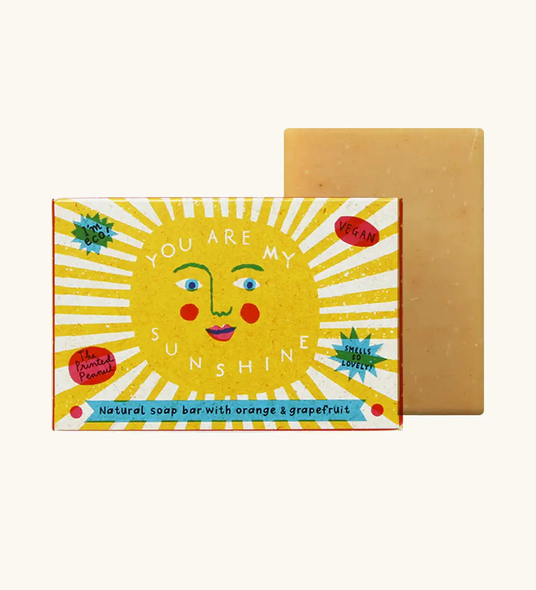 The Printed Peanut sunshine natural handmade orange and grapefruit soap bar standing to its decorated box showing the sun