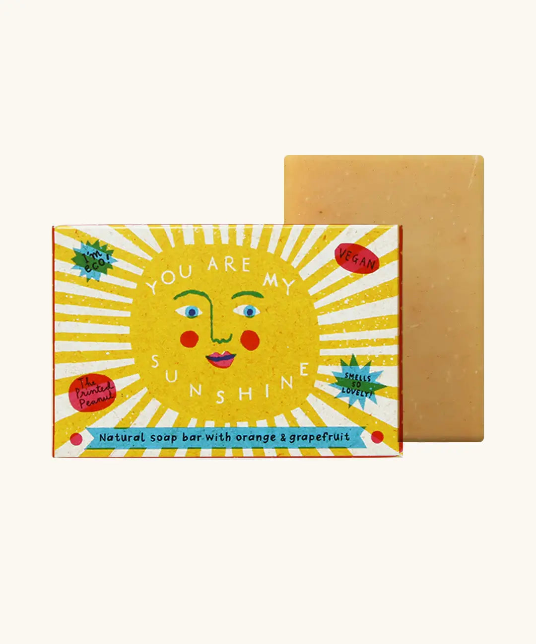 The Printed Peanut sunshine natural handmade orange and grapefruit soap bar standing to its decorated box showing the sun