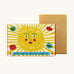 The Printed Peanut sunshine natural handmade orange and grapefruit soap bar standing to its decorated box showing the sun