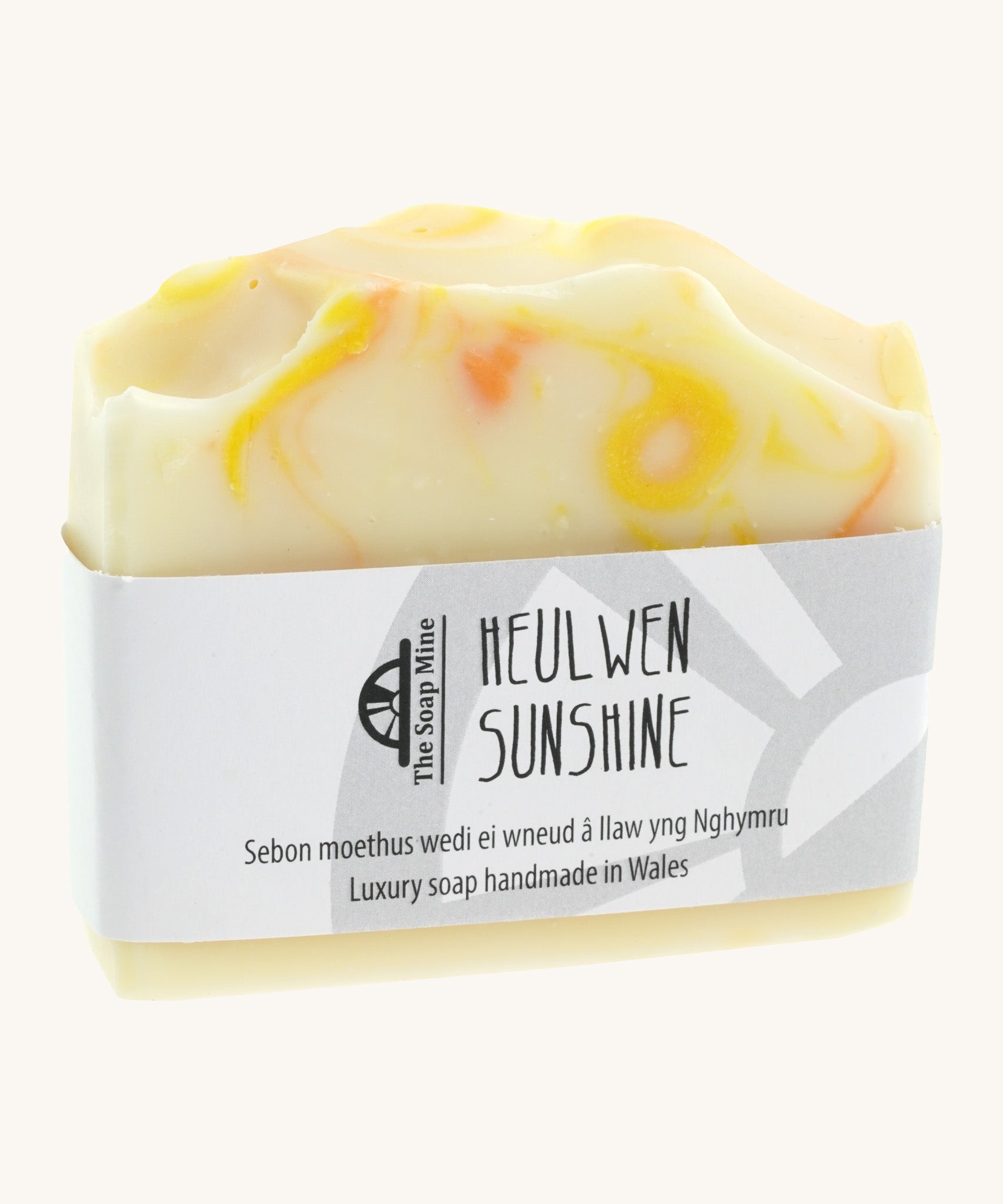 The Soapmine heulwen/sunshine bar. A Handmade soap available at Babipur with Bergamot and Mandarin essential oils. Comes with branding paper strip. 