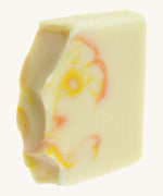 A close up of the The Soapmine heulwen/sunshine bar. A Handmade soap available at Babipur with Bergamot and Mandarin essential oils showing the hand cut detail 